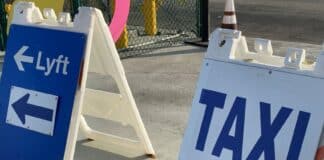 5 Easy Ways to Get to the Los Angeles and Long Beach Cruise Ports Taxi and Lyft sign at Los Angeles airport